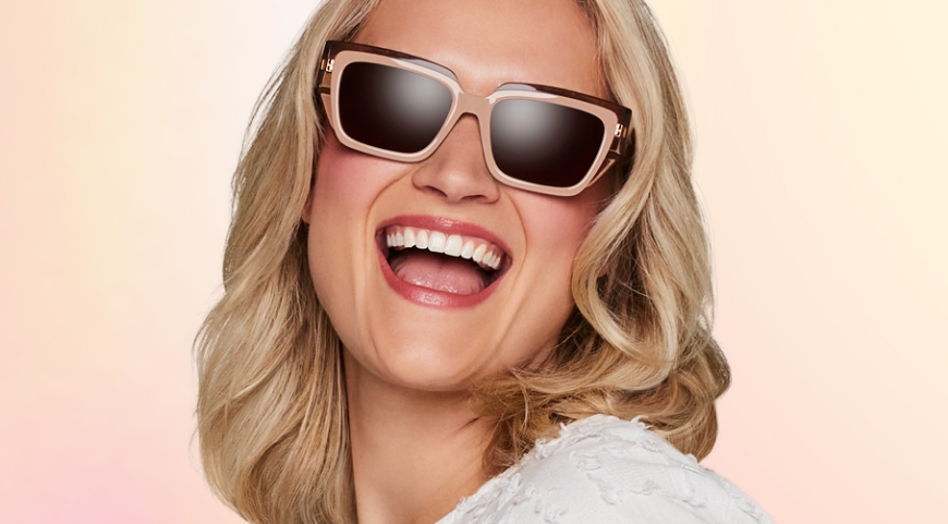 woman in glasses smiling